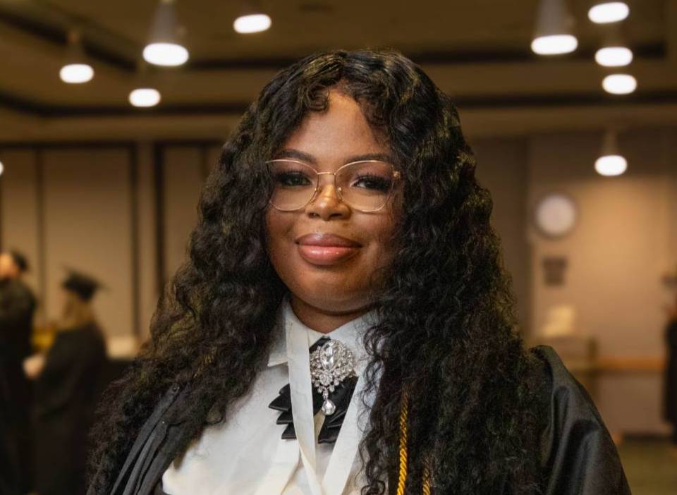 Marithe L. at commencement in Albany.
