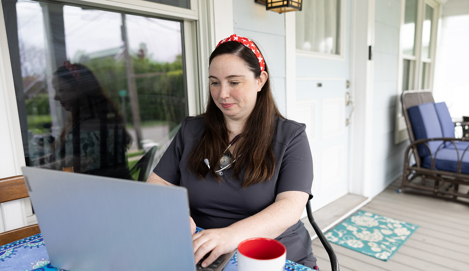 Healthcare professional doing school work