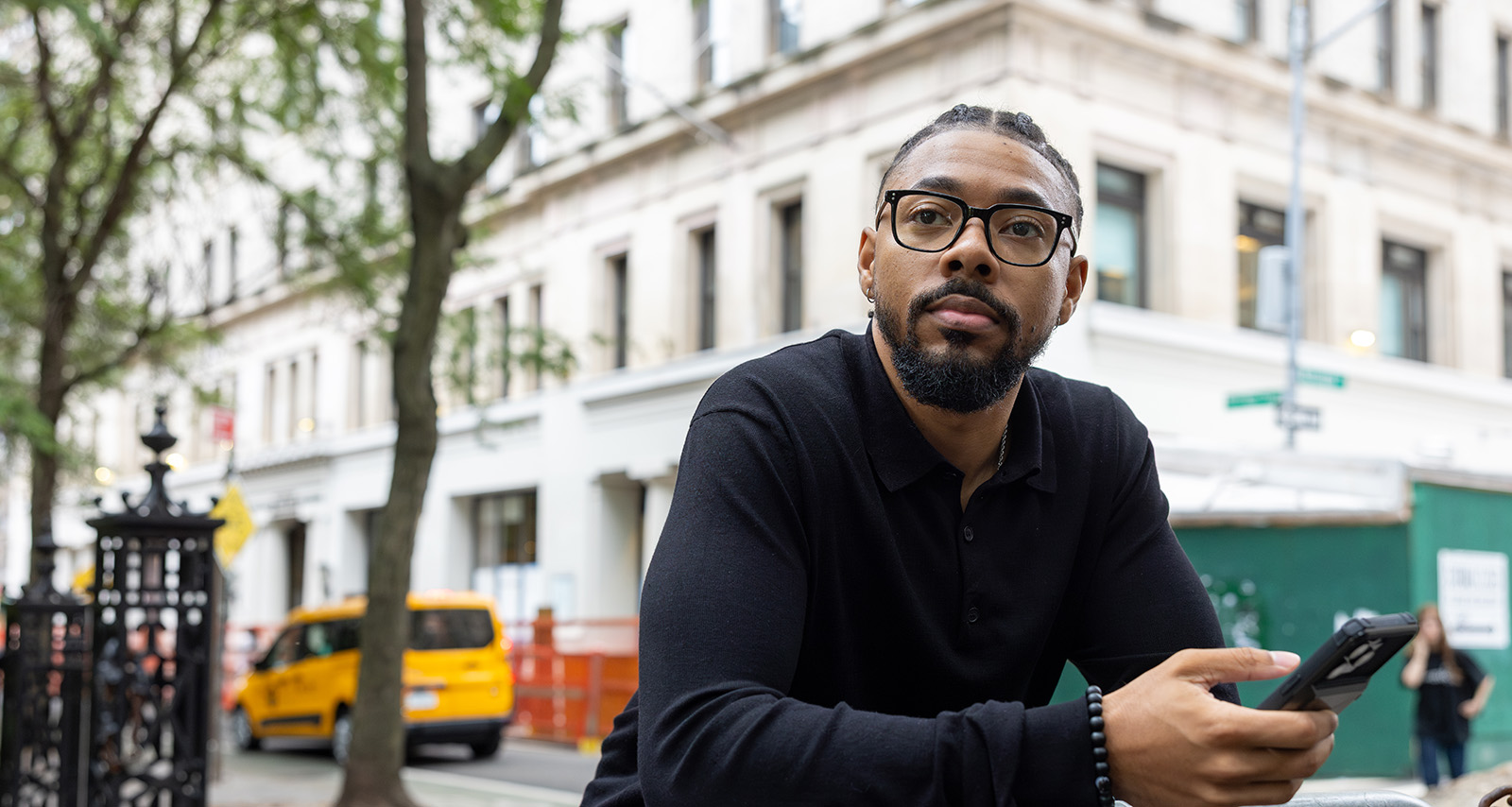 student leaning up against a railing
