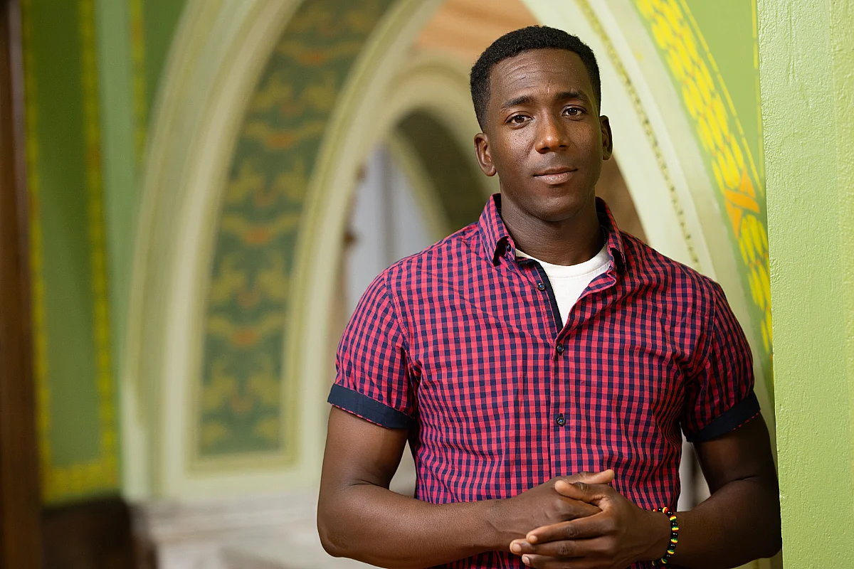 Student stands in library