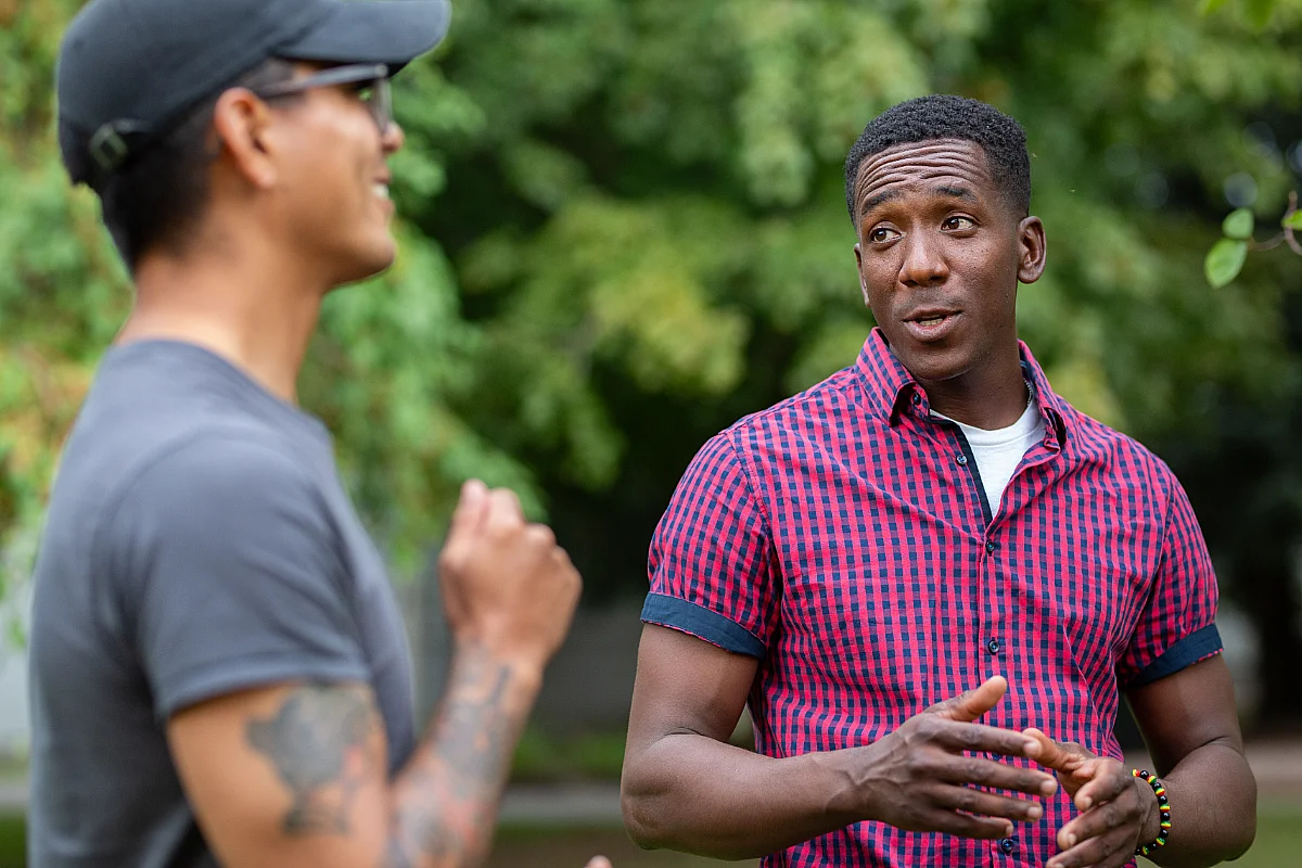 two students talking to each other outside