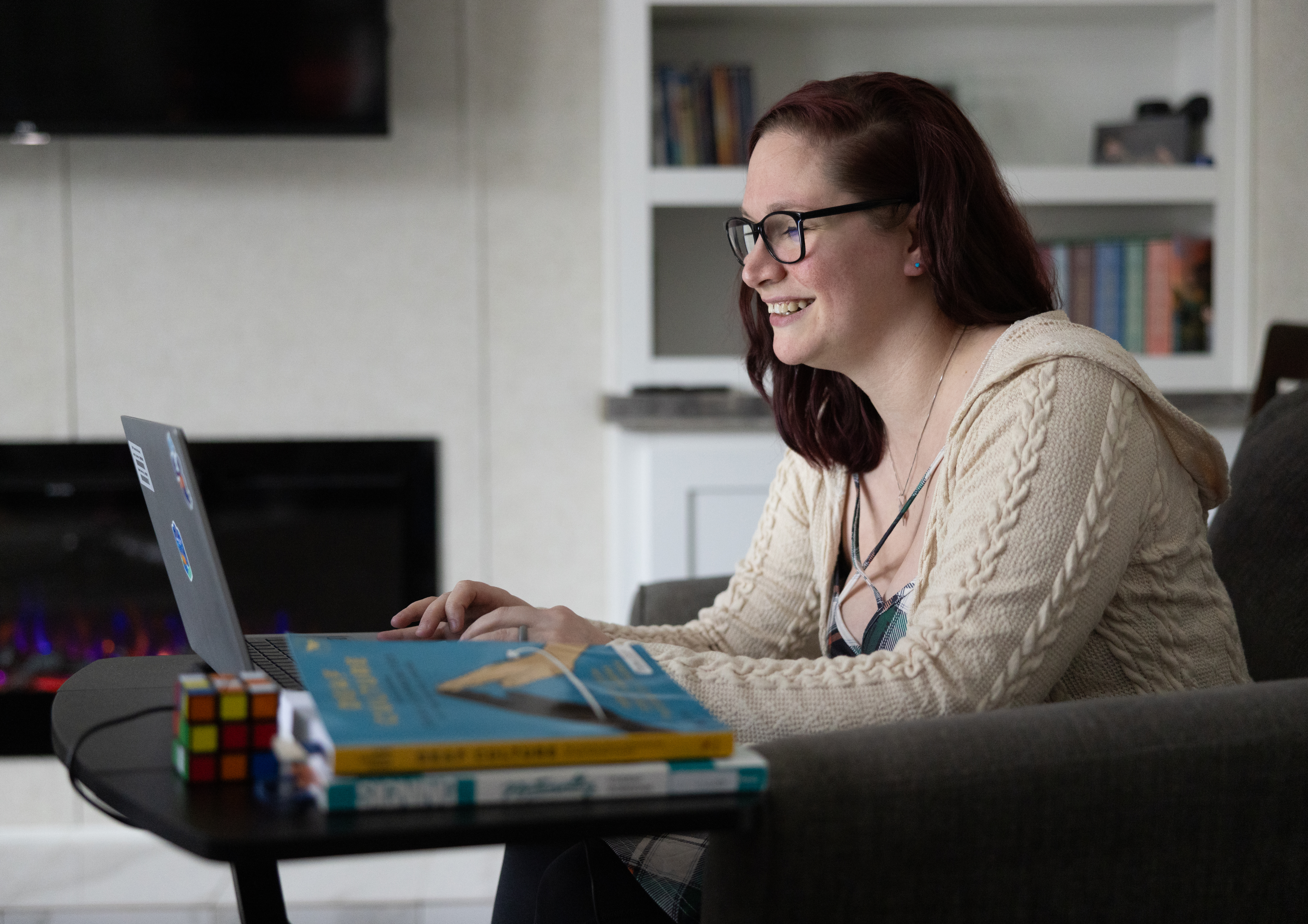 Woman engages in a virtual conversation on a laptop.