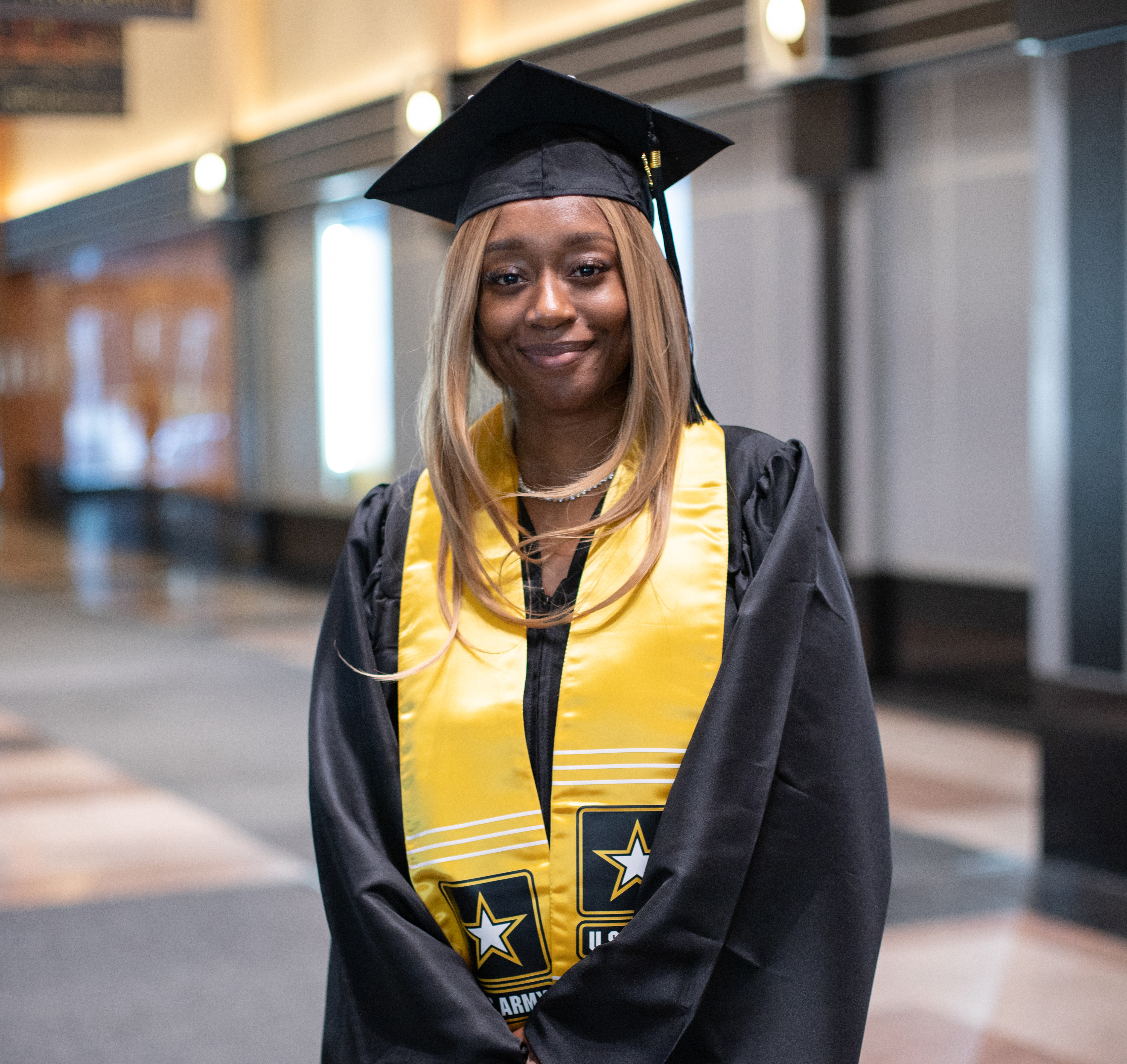 Woman Army graduate at commencement in New York City.