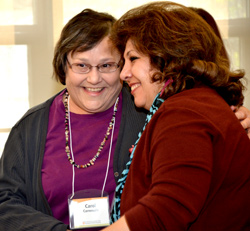 CDL Mentor Carol Carnevale, at left, learns she has received the Chancellor’s Award for Excellence in Faculty Service and is congratulated by her colleague CDL Mentor Nazik Roufaile.