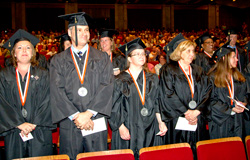 Members of Central New York Center's class of 2013 stand to be recognized. Images are by Michael J. Okoniewski of the 2013 Central New York Center graduation.
