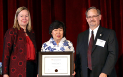 Left to right: Acting President Meg Benke, Jasmine Tang '96 and Dean Jonathan Franz. An author, scholar and educator, Tang received an award for her contributions to the field of world languages and culture.
