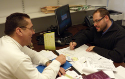Staten Island student Thomas Taratko, at left, meets with his faculty Mentor Dov Fischer. 
