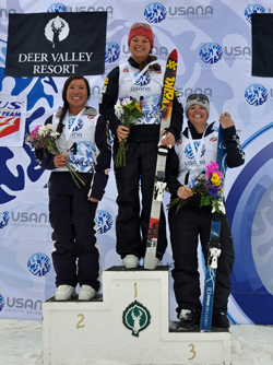 2014 Chancellor’s Award for Student Excellence recipient and two-time Olympian Ashely Caldwell, center, is seen here after winning the 2014 USANA National Championships in Aerials, held March 29 at Park City Utah. Photo/Riley Steinmetz/U.S. Ski Team